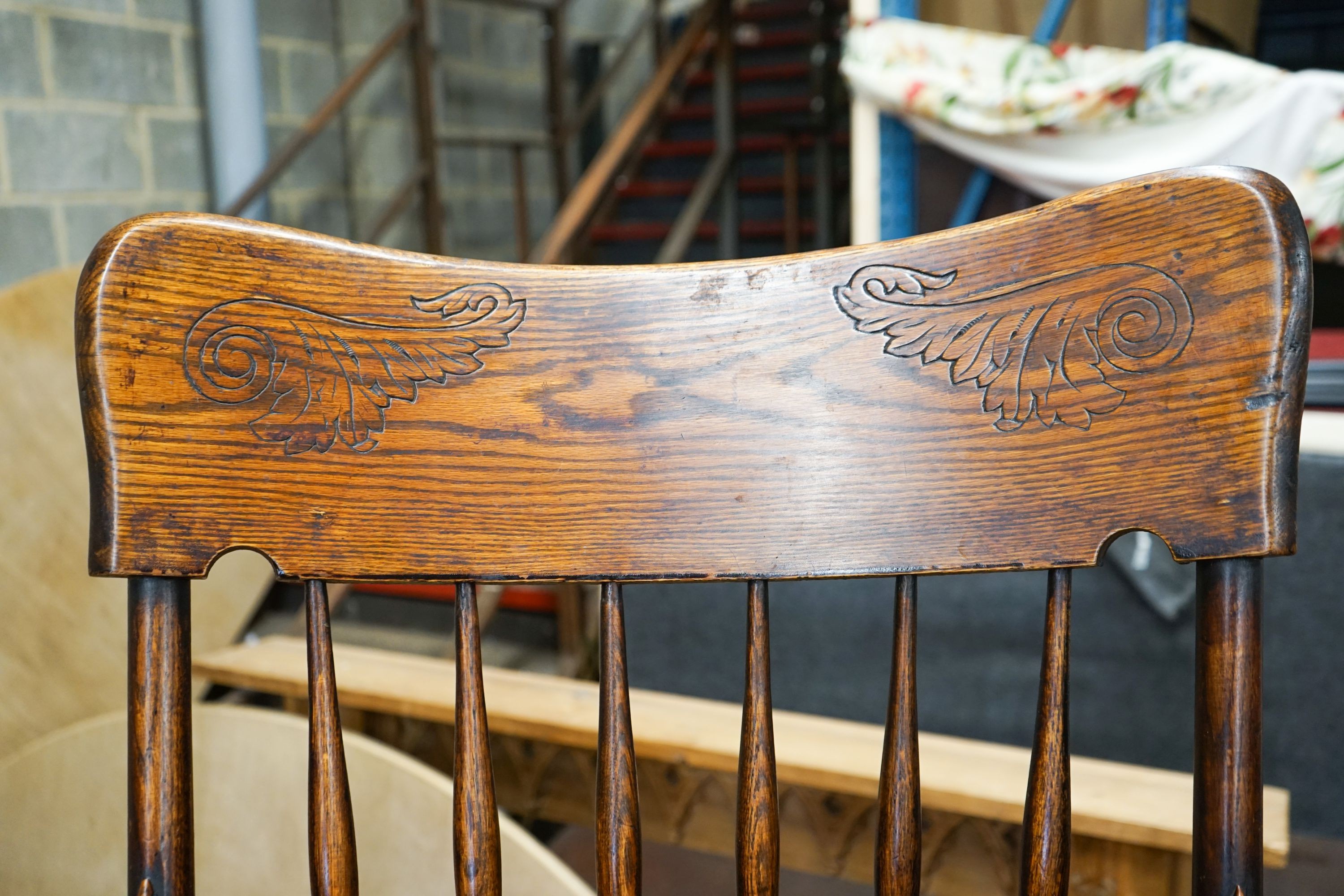 An early 20th century American elm and beech comb back armchair, width 57cm, depth 48cm, height 106cm